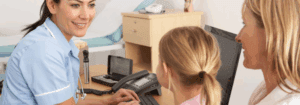 A mental health professional assisting a mother and child, showcasing the compassionate care and support provided in mental health roles, ideal for those seeking locum opportunities.