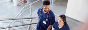 Two mental health clinicians walking through a healthcare setting, reflecting a positive and sustainable locum work environment