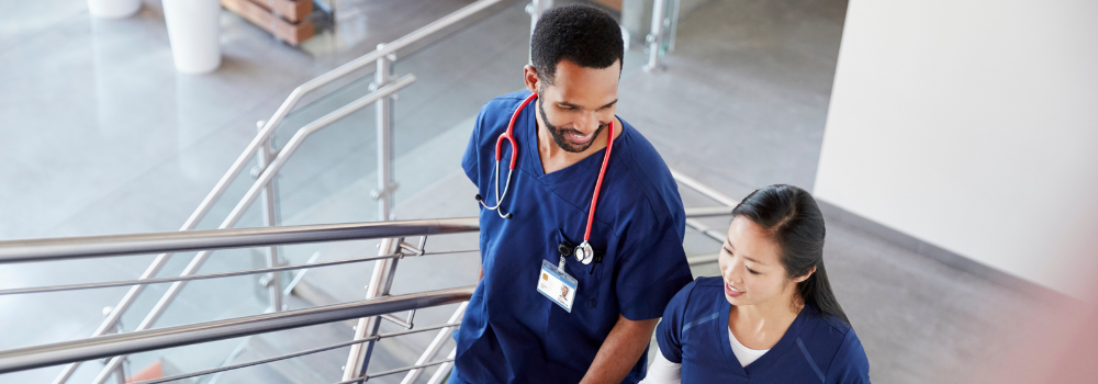 Two mental health clinicians walking through a healthcare setting, reflecting a positive and sustainable locum work environment