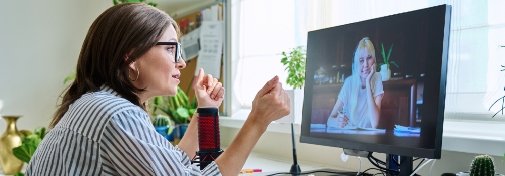 Therapist providing online counselling via video call, representing remote working in mental health services.