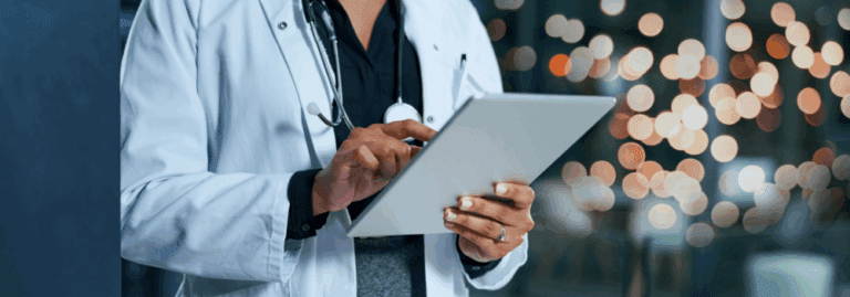 A healthcare professional using a digital tablet, symbolising the role of AI and technology in modern mental healthcare.