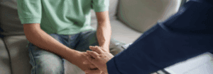 A mental health professional offering support to a patient during a consultation, symbolising care, trust, and wellbeing.