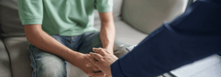 A mental health professional offering support to a patient during a consultation, symbolising care, trust, and wellbeing.