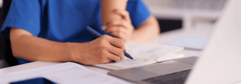 Clinician writing notes during an ADHD and Autism assessment, supporting increased service capacity.